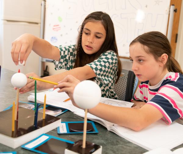 students work with moon phases model