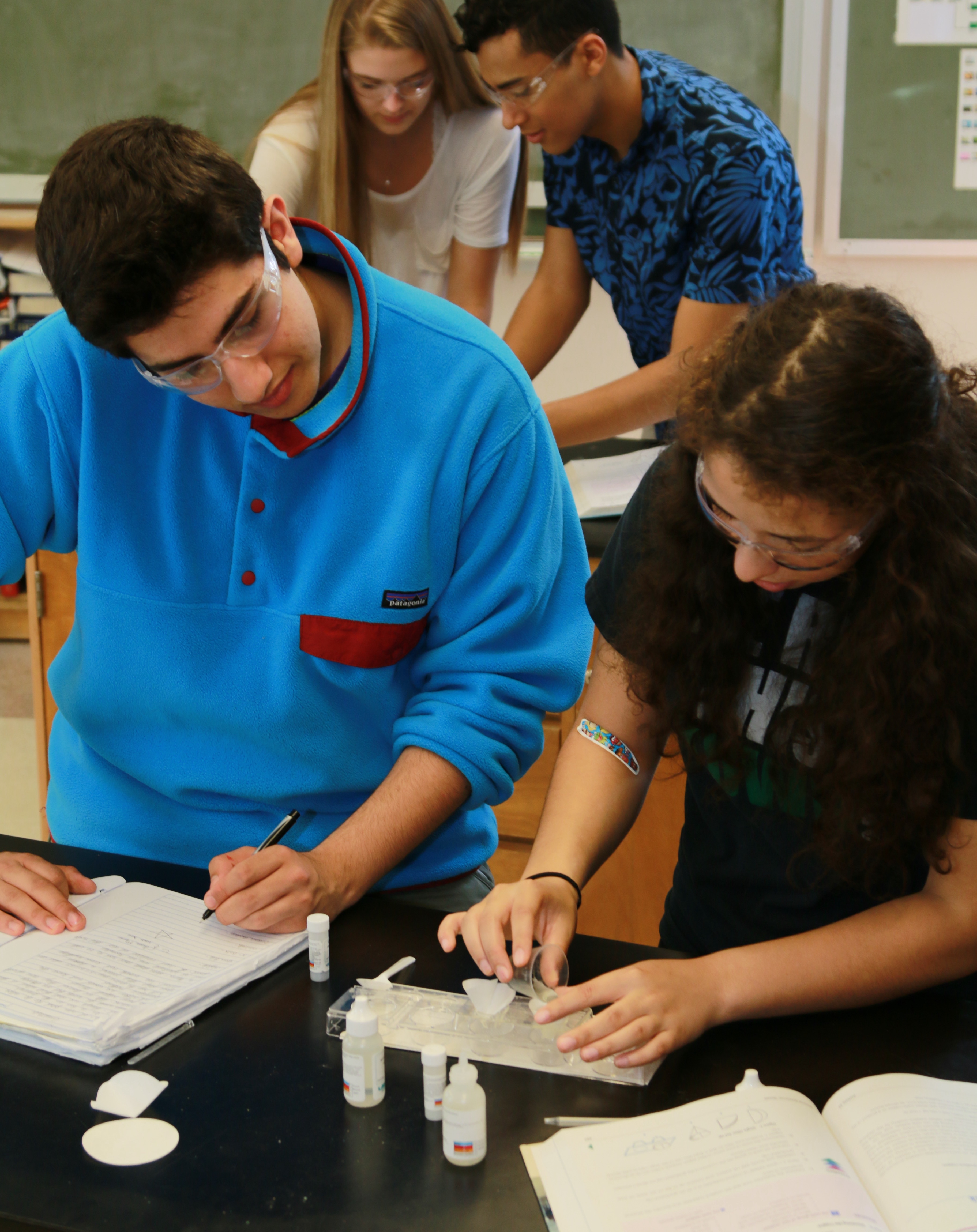 Students take observations during a lab. 