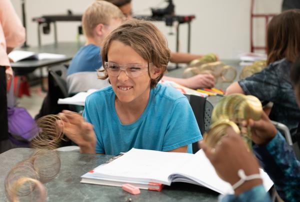 Student making waves with a slinky