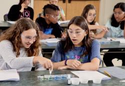 two students at lab desk